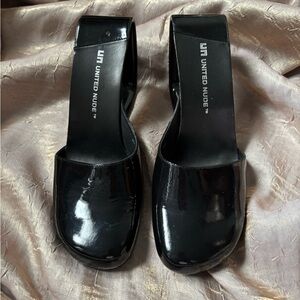 High heel patent leather mule in size 8. Best fit would be a well arched foot.